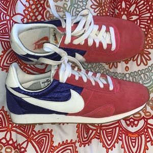 Red and Purple Nike shoes